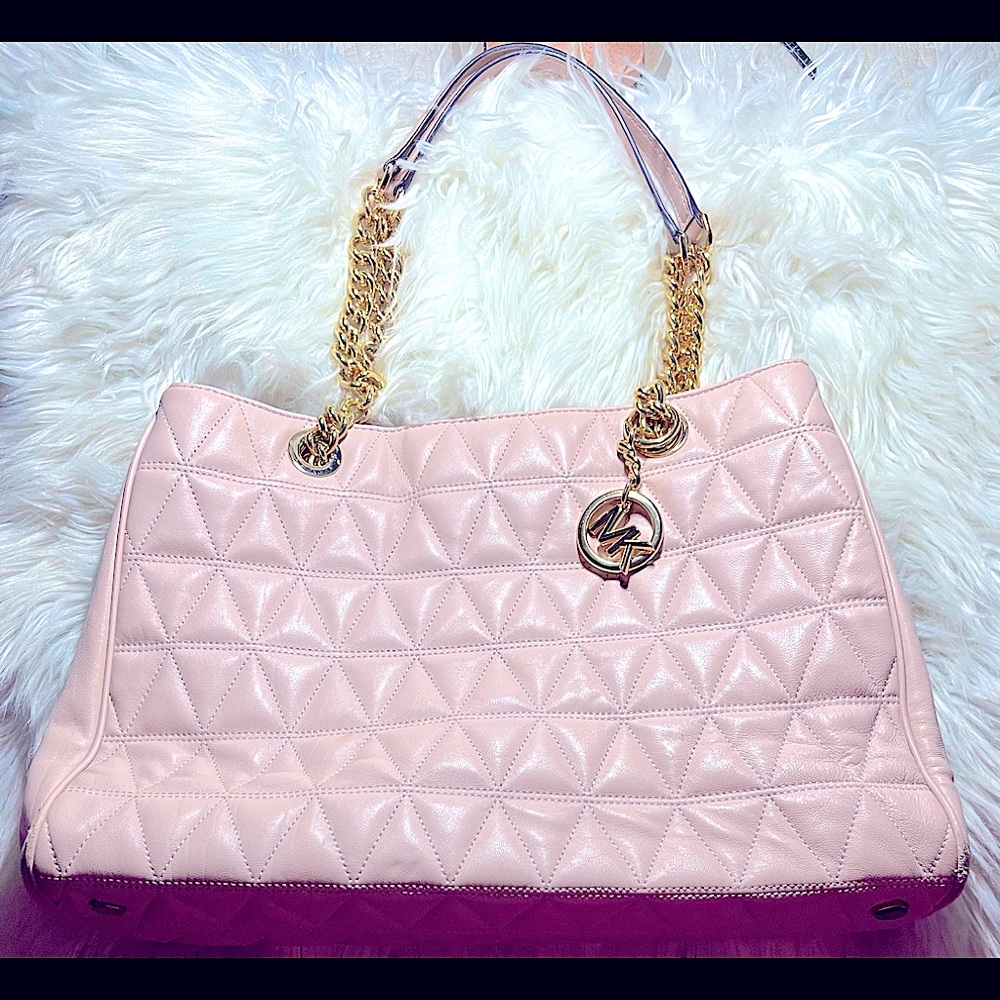 Michael Kors light pink quilted purse with gold chain straps and emblem